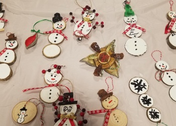 Snowman tree cookie ornaments made at a past Holiday Craft Workshop