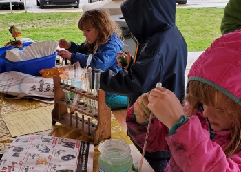 Children doing dye experiments at the park.