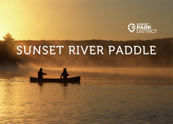 two canoers on the river at sunset