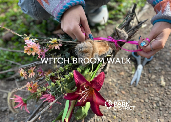 Hands tie a ribbon on a finished natural broom