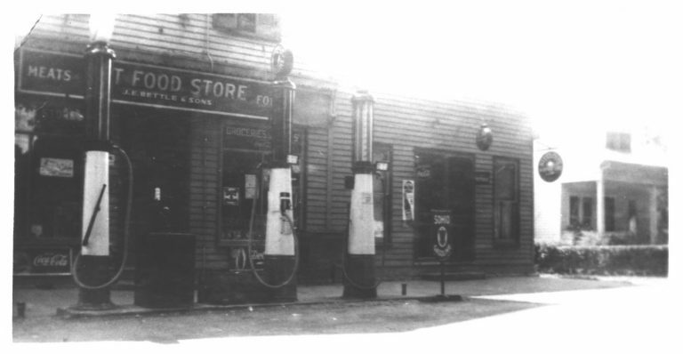 black and white photo of gas pumps
