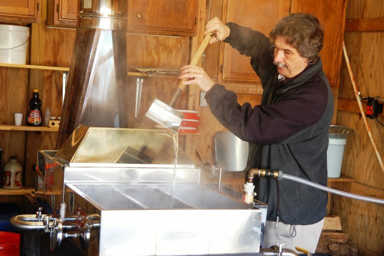 man making syrup