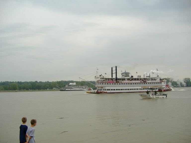 Kids watching boats on water