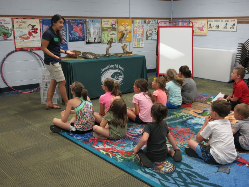 group of kids sitting on mat